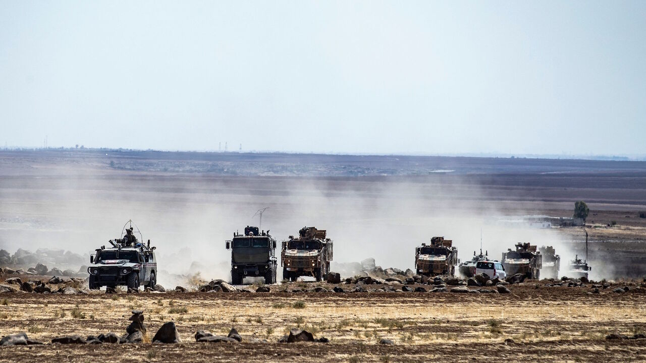 Turkish and Russian military vehicles patrol in the countryside of Rumaylan (Rmeilan) in Syria's northeastern Hasakeh province near the Turkish border, on Sept. 16, 2021. 