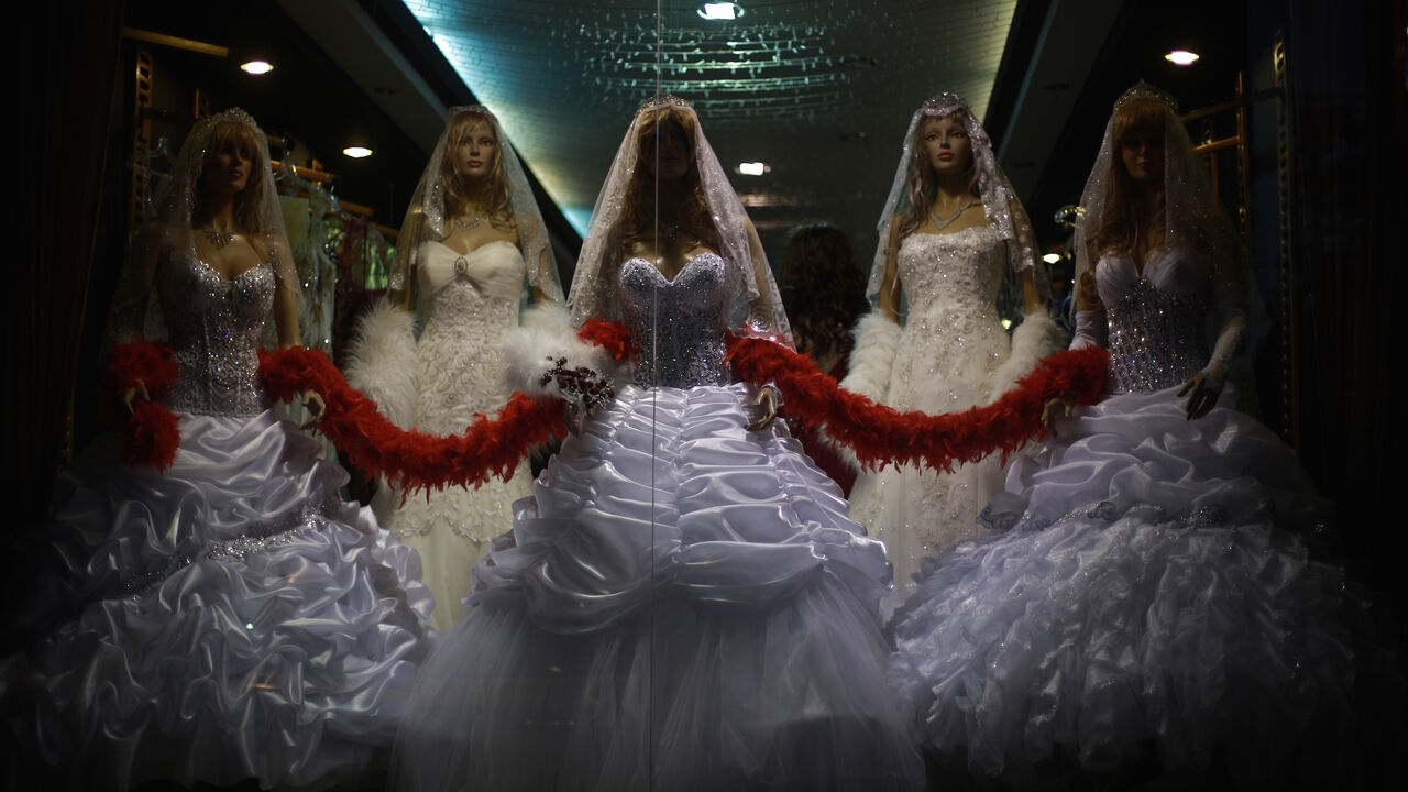 Mannequins display wedding gowns designed by the al-Ashi family at their atelier in Gaza City on June 3, 2013. 