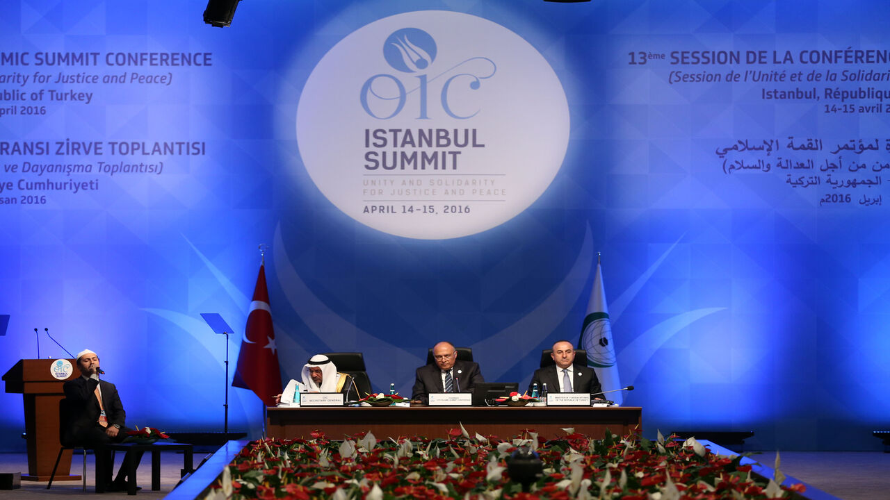 Secretary-General of the Organization of Islamic Cooperation (OIC) Iyad bin Amin Madani (L), Egyptian Foreign Minister Sameh Shoukry and Turkish Foreign Minister Mevlut Cavusoglu attend the 13th OIC Summit at Istanbul Congress Center, Turkey, April 14, 2016.
