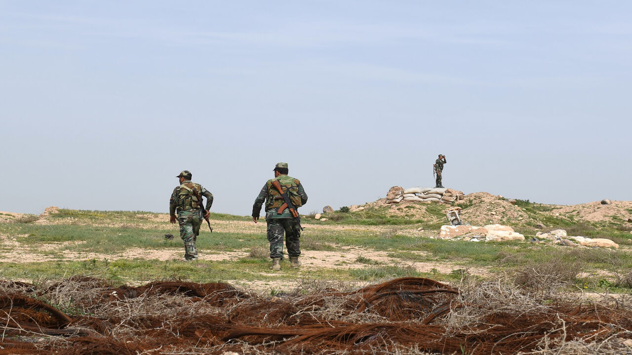 Syrian government forces patrol the northern town of Tel Rifaat, Syria, March 28, 2018.