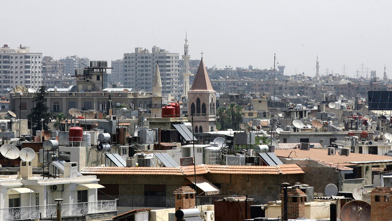 The minarets of mosques and the steeples of churches are seen towering above rooftops in the Syrian capital Damascus, on June 26, 2013. 