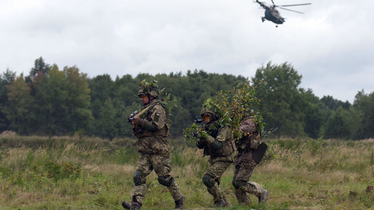 Ukrainian servicemen take part in the joint Rapid Trident military exercises with the United States and other NATO countries nor far from Lviv on Sept. 24, 2021, as tensions with Russia remain high over the Kremlin-backed insurgency in the country's east. 