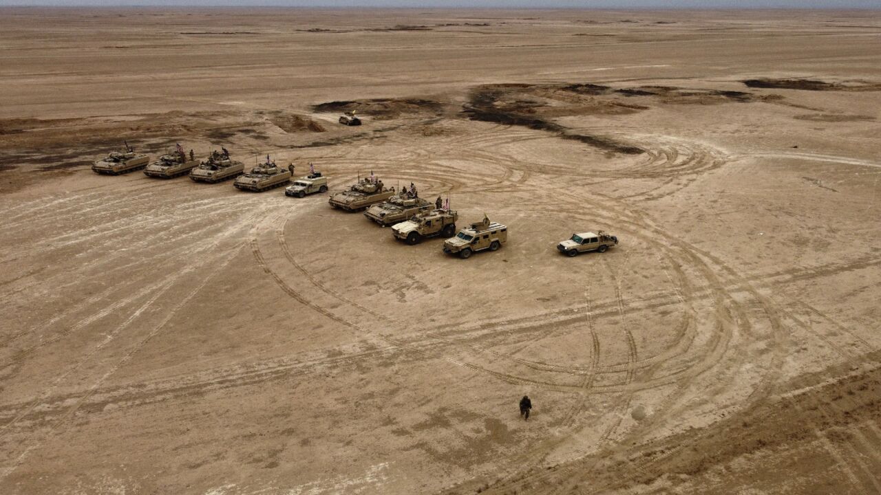 This picture taken on Dec. 7, 2021, shows an aerial view of US Bradley Fighting Vehicles (BFV) during a joint military exercise.