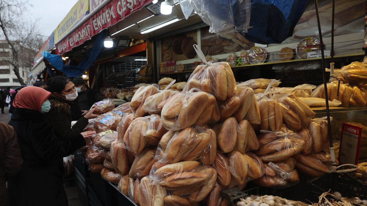 Women shop bread at a market in Ankara on Dec. 20, 2021.