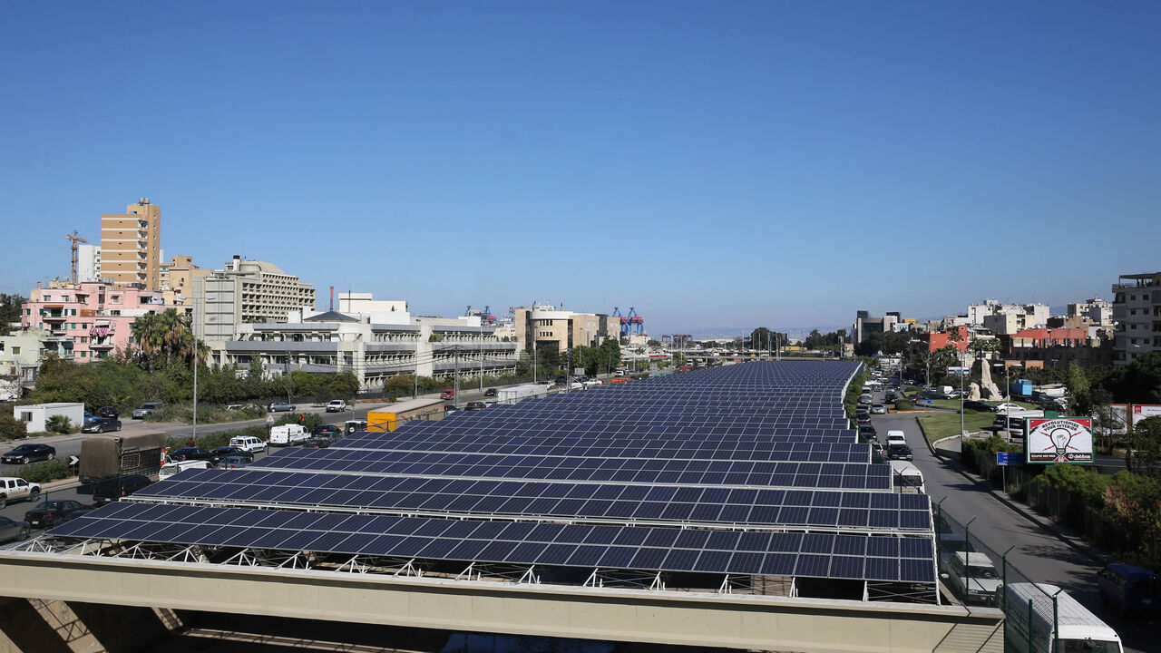 Solar panels are seen above the river bed in Beirut, Lebanon, Nov. 12, 2015.