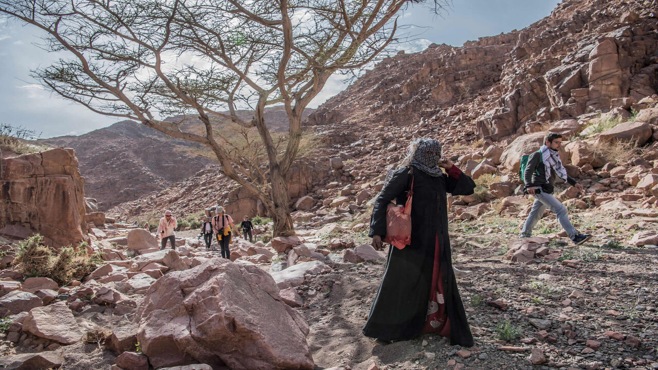 Umm Yasser (2nd-R), an Egyptian Bedouin female guide from the Hamada tribe, leads a group of hikers in Wadi el-Sahu in the southern Sinai governorate, during the first Sinai Trail led by Bedouin female guides, Egypt, March 29, 2019.