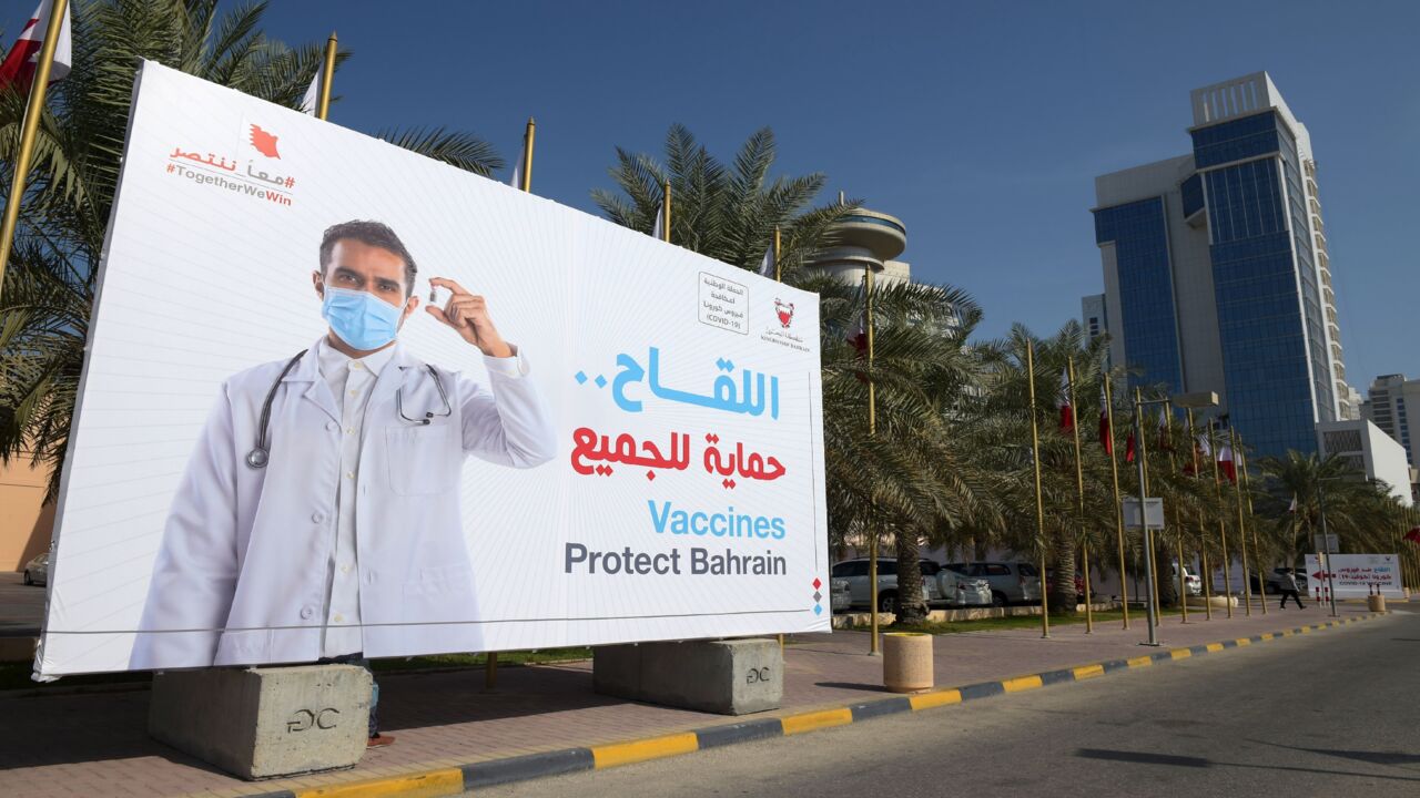  A large billboard encourages people to take part in a free vaccination campaign against COVID-19 in the capital, Manama, on Dec. 24, 2020.
