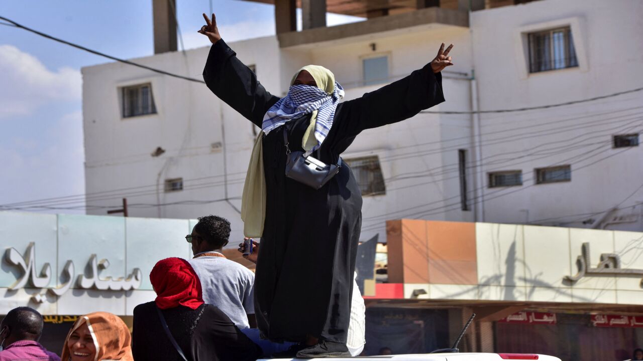A Sudanese woman takes part in a protest in the city of Khartoum Bahri to demand the government's transition to civilian rule, on Oct. 21, 2021.