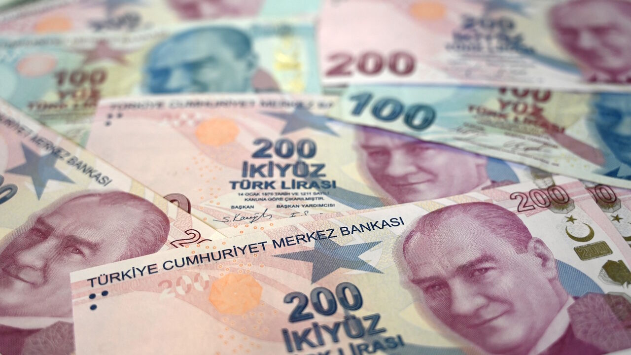 A picture taken on Dec. 7, 2021 in Istanbul shows Turkish lira banknotes. 