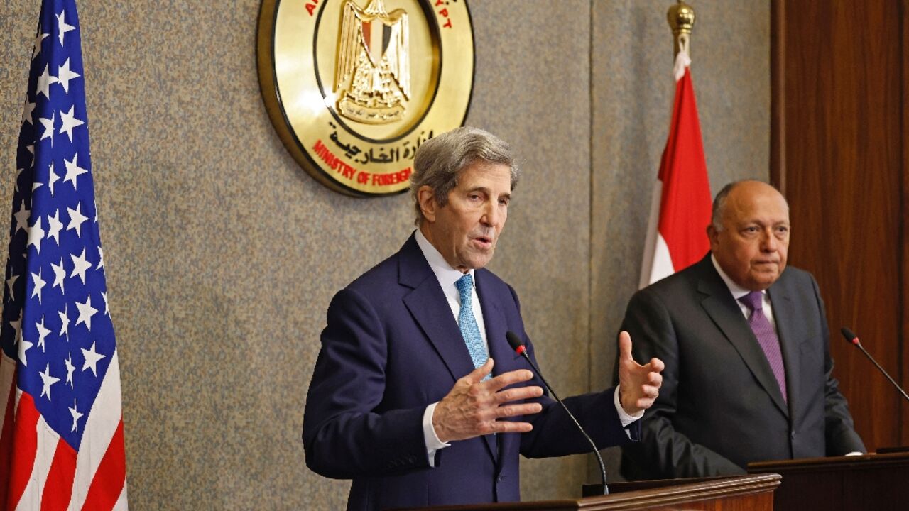 United States climate envoy John Kerry, on the left, and Egypt's Foreign Minister Sameh Shoukri hold a joint press conference in the capital Cairo, on February 21, 2022