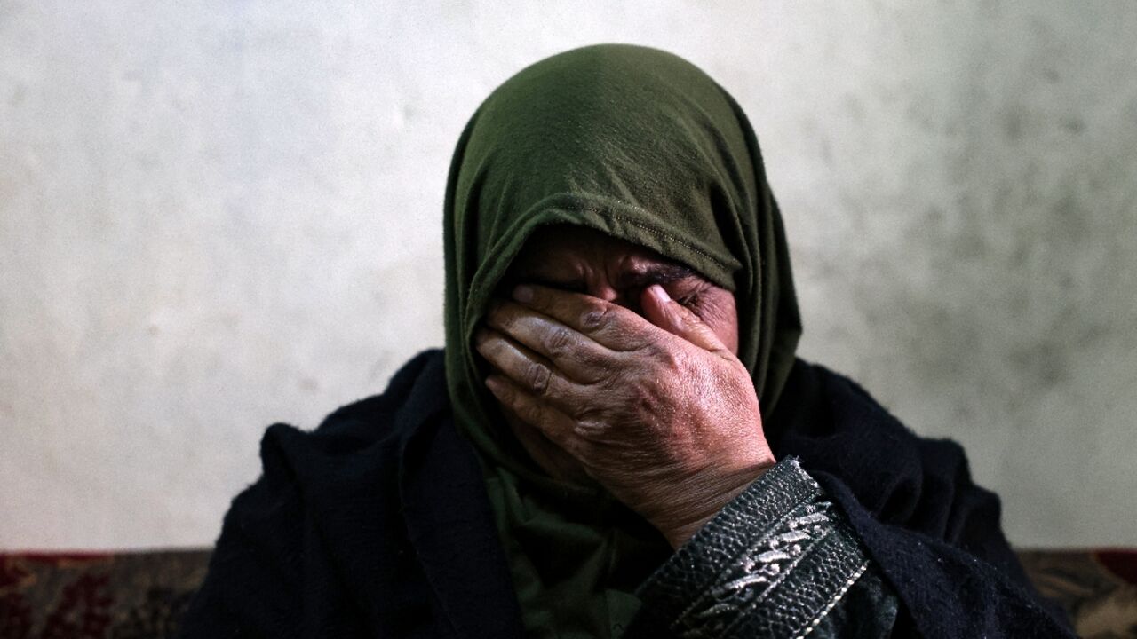 Ghufran, 56, the mother of Zakaria al-Adl, a member of the Islamic State group killed in Iraq, wipes her tears during an interview in her house in the Lebanese city of Tripoli