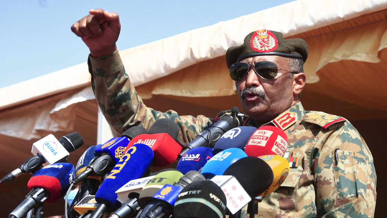 Sudan's top Gen. Abdel Fattah al-Burhan speaks as he attends the conclusion of a military exercise in the Maaqil area, northern Nile River State, Sudan, Dec. 8, 2021.