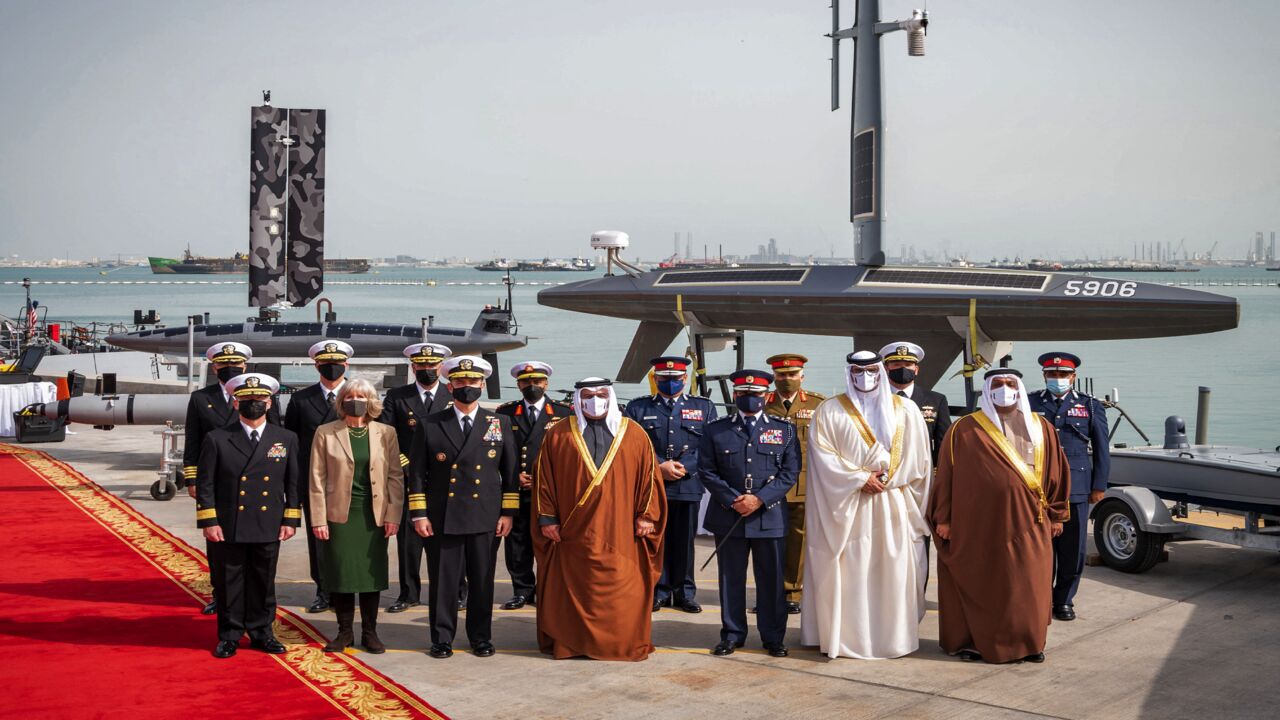 Image released by US Naval Forces Central Command on Jan. 31, 2022, shows Prince Salman bin Hamad al-Khalifa (C); Vice Admiral Brad Cooper (C-L); and Maggie Nardi (2nd-L), charge d'affairs, US Embassy to Bahrain, at Naval Support Activity (NSA) Bahrain.