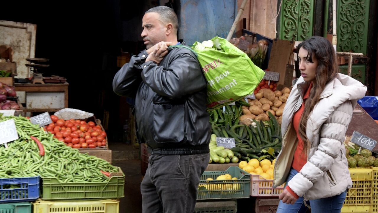 Tunisians shop at Halfaouine market near central Tunis on February 15, 2022. The Tunisian economy is plagued by recession, inflation and high unemployment