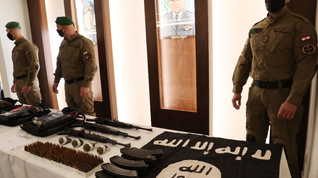 Lebanon's Internal Security Forces show off weapons and other materials they say were seized from the Islamic State group during an operation to thwart a bomb plot against Beirut's southern suburbs