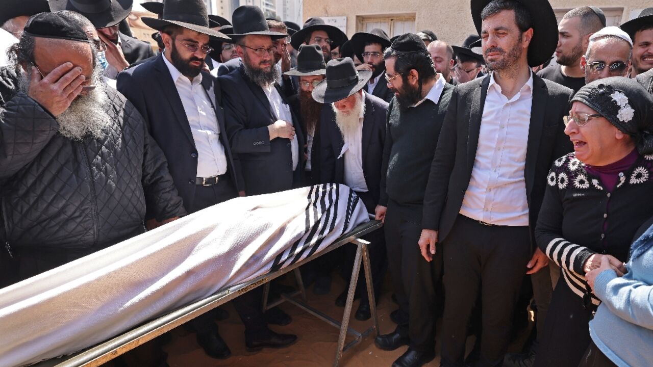 Israeli mourners attend the funeral of Avishai Yehezkel, one of five people killed in a shooting attack in the ultra-religious city of Bnei Brak