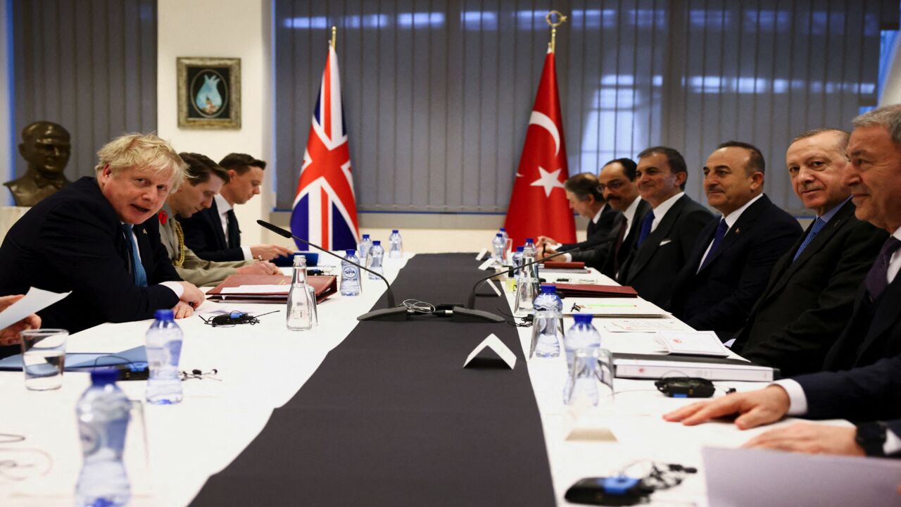 Britain's Prime Minister Boris Johnson (L) and Turkey's President Tayyip Erdogan (2R).