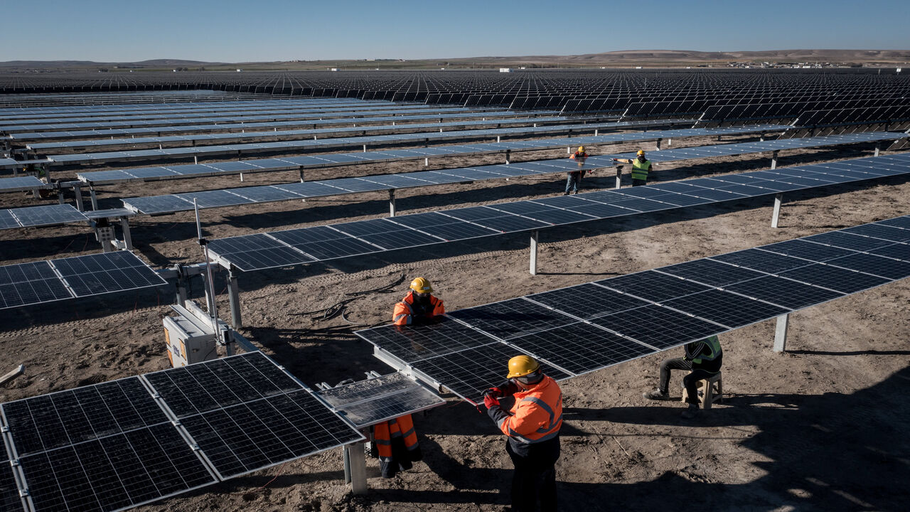 Employees install new solar panels at the Kalyon Energy's Karapinar Solar Power Plant, Karapinar, Turkey,  Dec. 2, 2021.