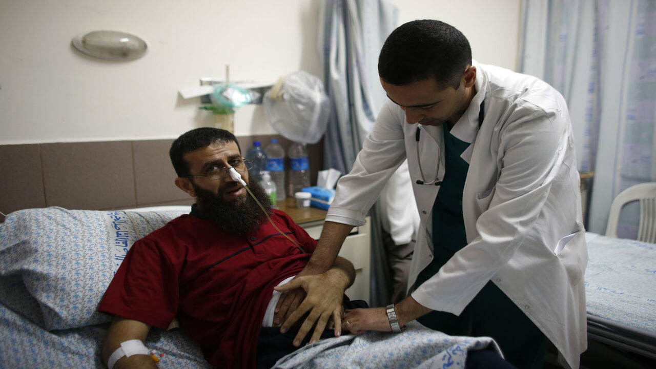 Palestinian Khader Adnan, who staged a 56-day hunger strike while being detained for a year without charge by Israeli authorities and who Israel says is a member of Islamic Jihad, lies on a bed as he is treated at the Makassed hospital in East Jerusalem, July 15, 2015.