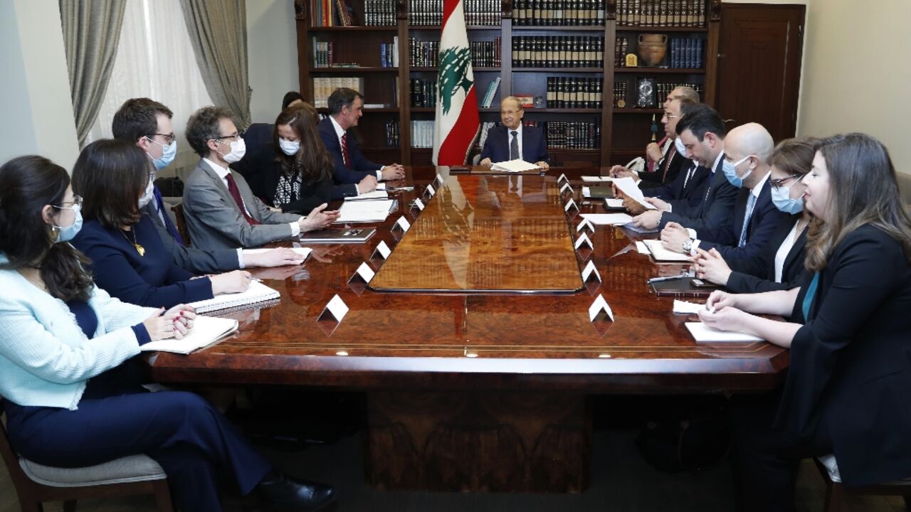 Lebanon's President Michel Aoun meets the International Monetary Fund (IMF) delegion at the presidential palace in Baabda, east of the capital Beirut, on March 30, 2022