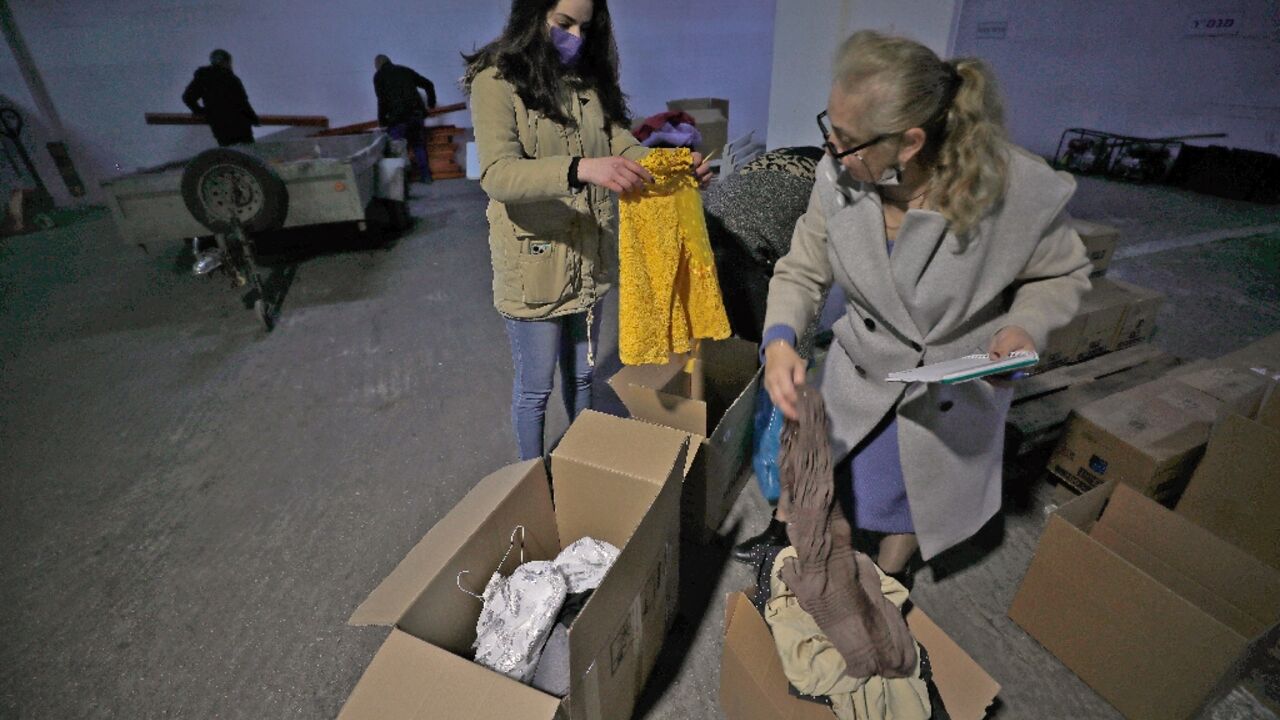 Volunteers gather donated items to welcome refugees fleeing the war in Ukraine in the northern Israeli town of Nof Hagalil, where roughly half the inhabitants speak Russian