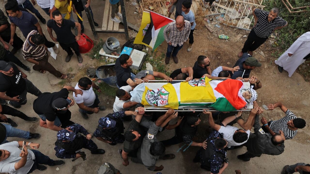 Palestinians carry the body of Ahmed Ibrahim Oweidat, killed during an operation by Israeli forces in the occupied West Bank 