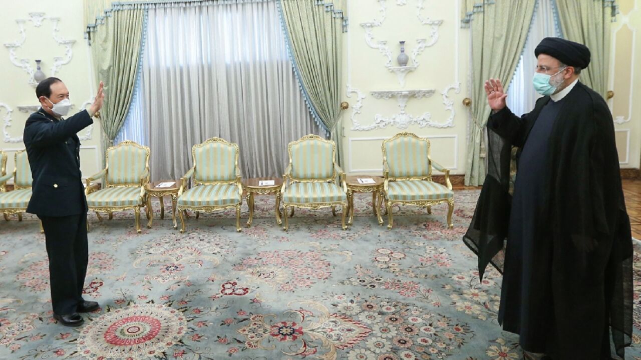A handout picture provided by the Iranian presidency on April 27, 2022 shows President Ebrahim Raisi meeting with Chinese Defense Minister Wei Fenghe in Tehran