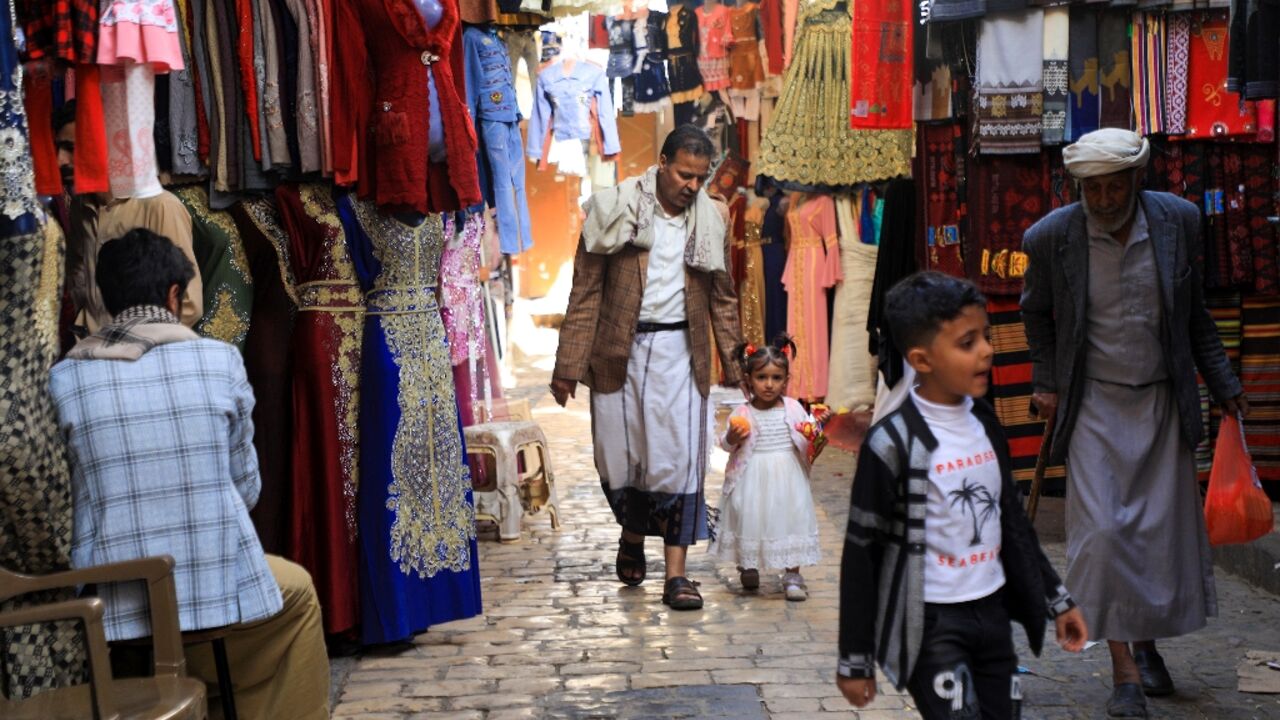 Yemenis shop at a market in the old city of the Yemeni capital Sanaa on the first day of the Muslim holy month of Ramadan, on April 2, 2022