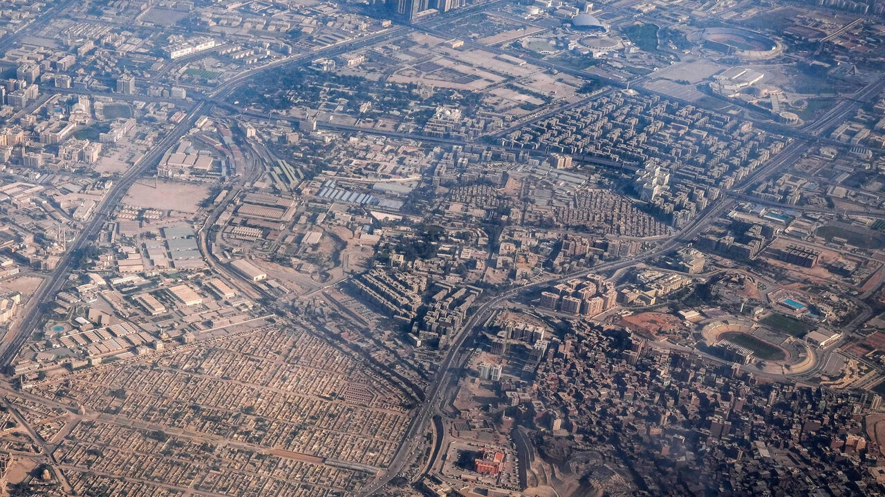 This aerial view shows the City of the Dead (bottom L), near the Darassa district, Cairo, Egypt, Jan. 15, 2021.