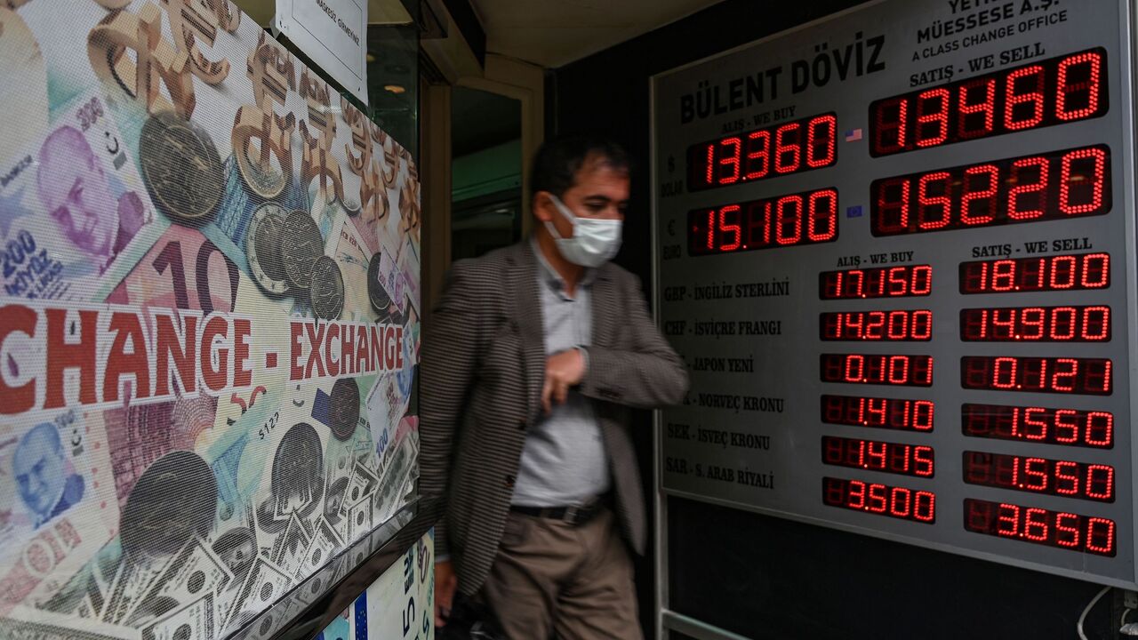 A customer leaves a currency exchange agency near Grand Bazaar in Istanbul, on Dec. 2, 2021. 
