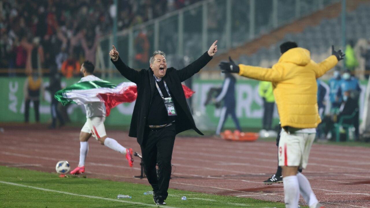 Iran coach Dragan Skocic celebrates after qualifying for the World Cup following his side's win against Iraq in January