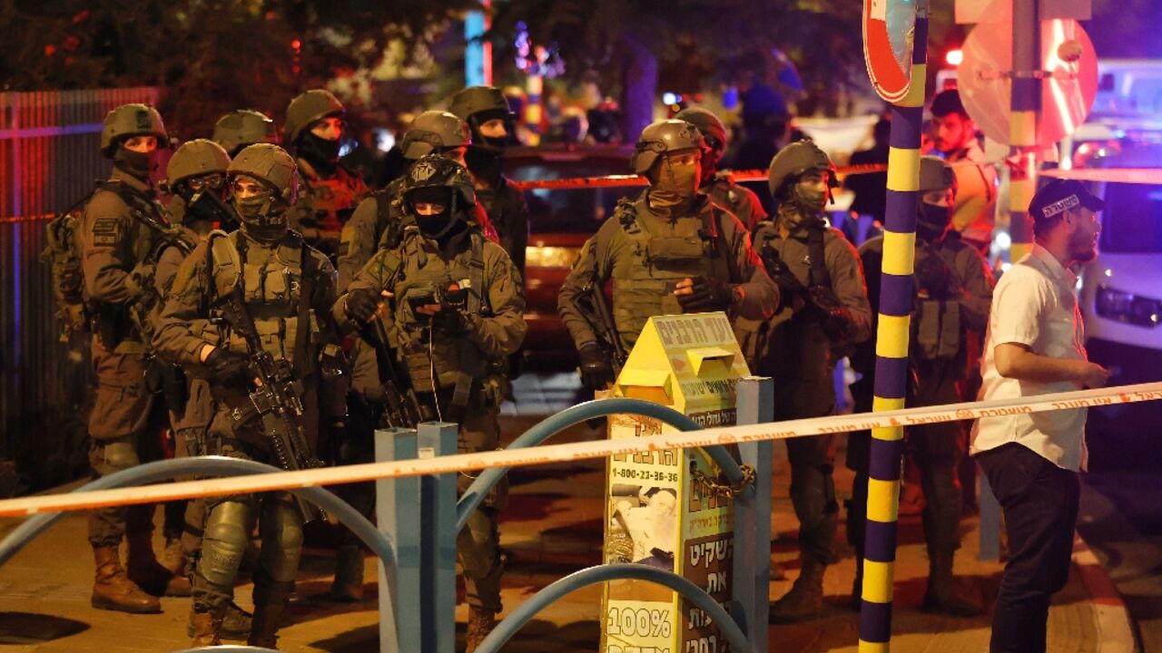 Israeli security forces are pictured at the scene of an attack in the central city of Elad on May 5