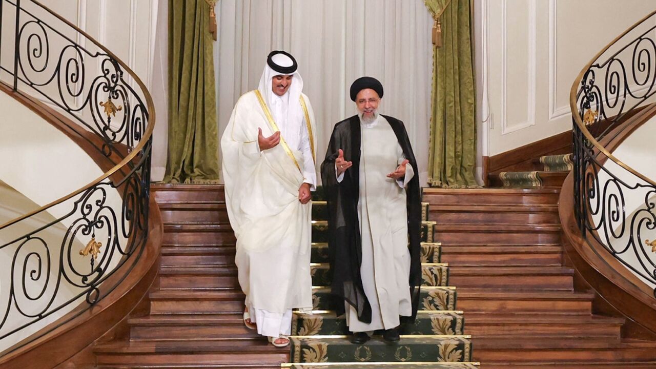 Iran's President Ebrahim Raisi (R) and visiting Qatari Emir Sheikh Tamim bin Hamad Al-Thani (L) both pointed to Israeli responsibility in the death of Al Jazeera journalist Shireen Abu Akleh