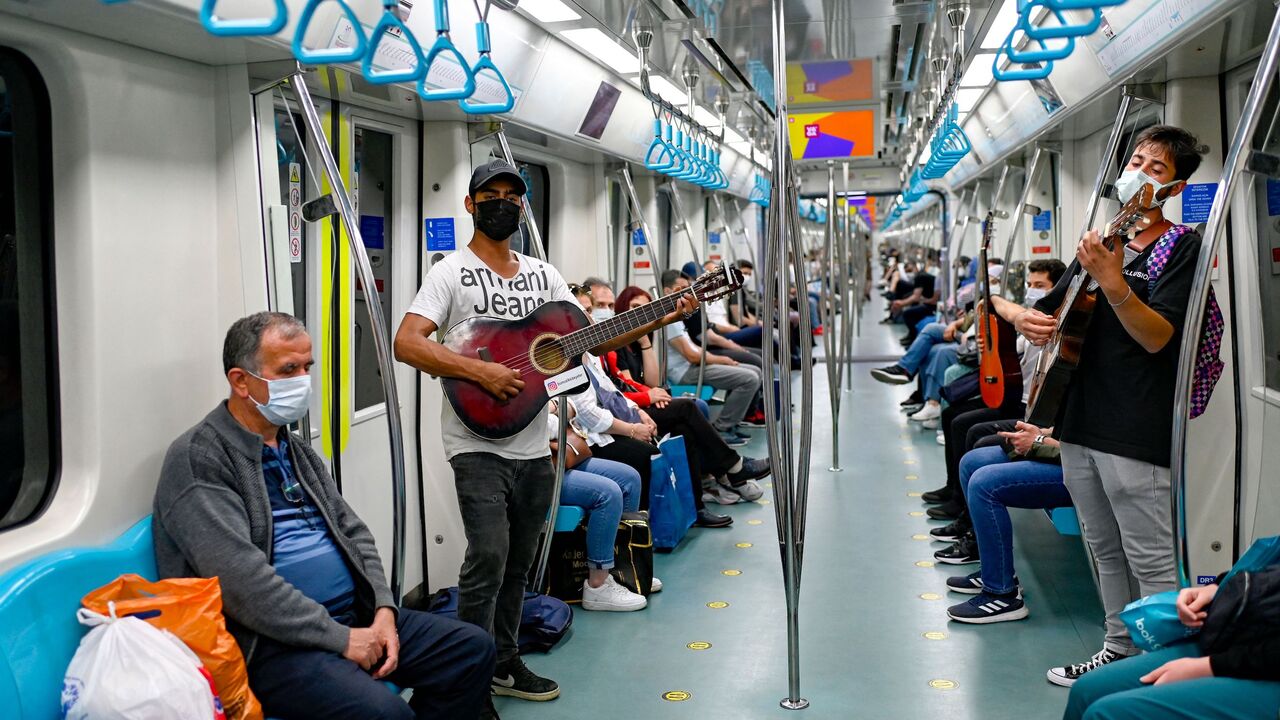 Amateur musicians play in the Istanbul metro during the performance ban due to COVID-19 in Istanbul on June 9, 2021.