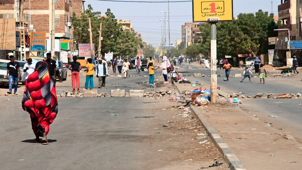 Sudanese demonstrators barricade Al-Sahafa street during ongoing protests against a military coup, Khartoum, Sudan, Jan. 18, 2022.