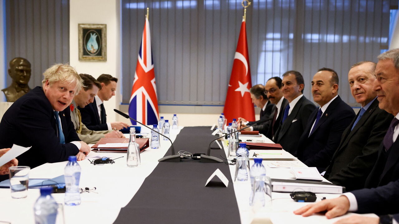 British Prime Minister Boris Johnson (L) and Turkish President Tayyip Erdogan (2R).