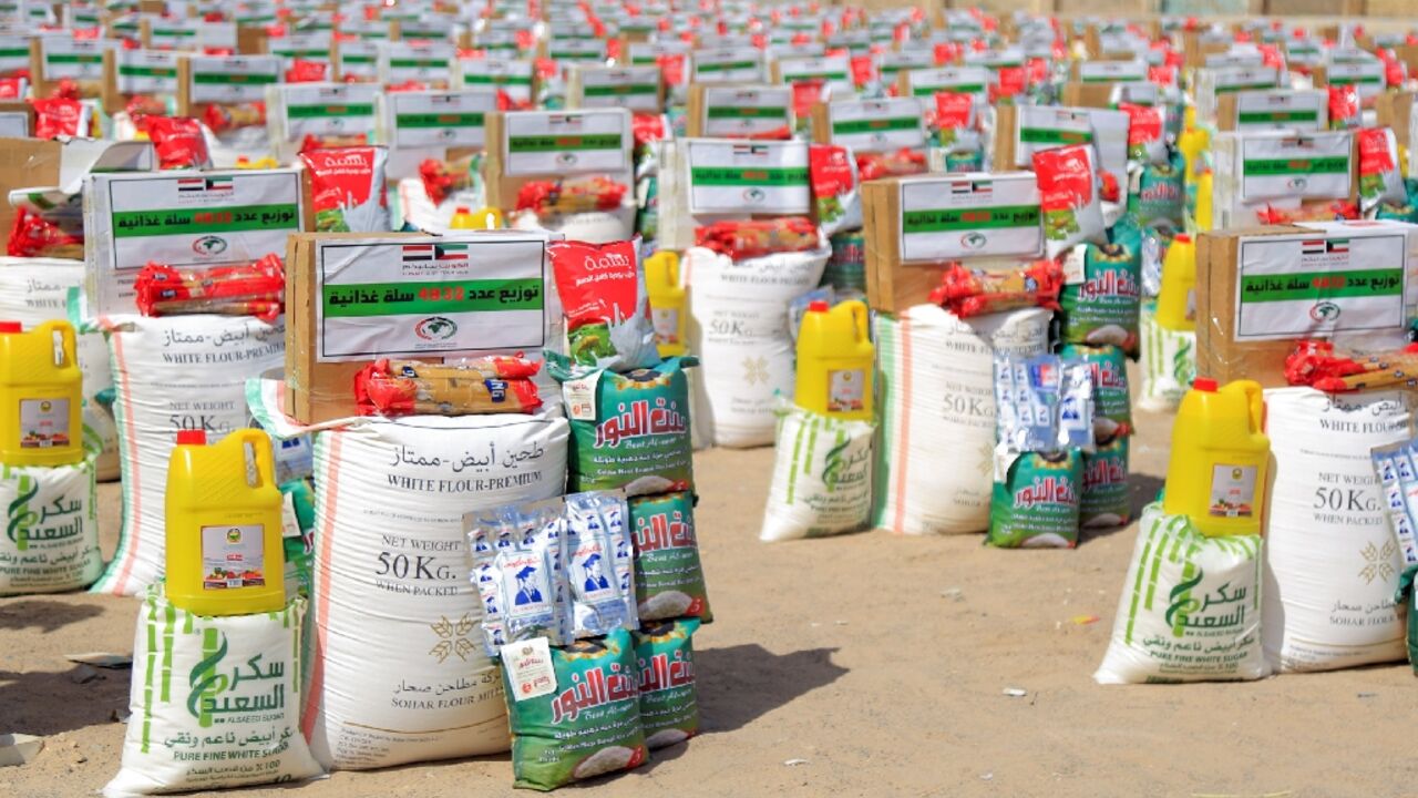 In this file photo taken on April 23, 2022, food aid rations donated by a Kuwaiti charitable organisation are prepared for distribution to displaced Yemenis on the outskirts of the northeastern city of Marib