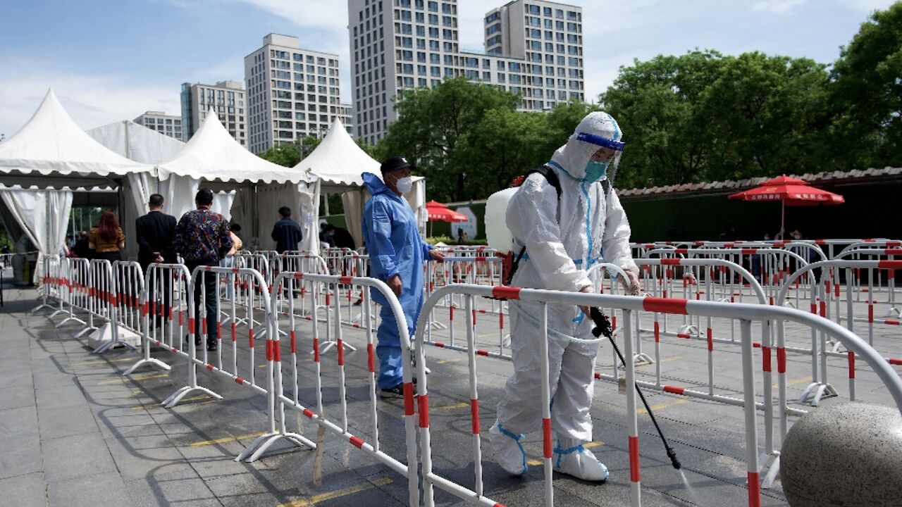 Authorities in China are pursuing a strategy of stamping out the virus entirely, which includes rapid lockdowns and mass testing
