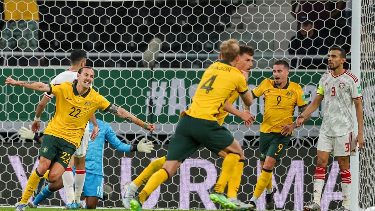 Ajdin Hrustic (C behind) scored a late winner to put Australia one victory away from a place at the World Cup