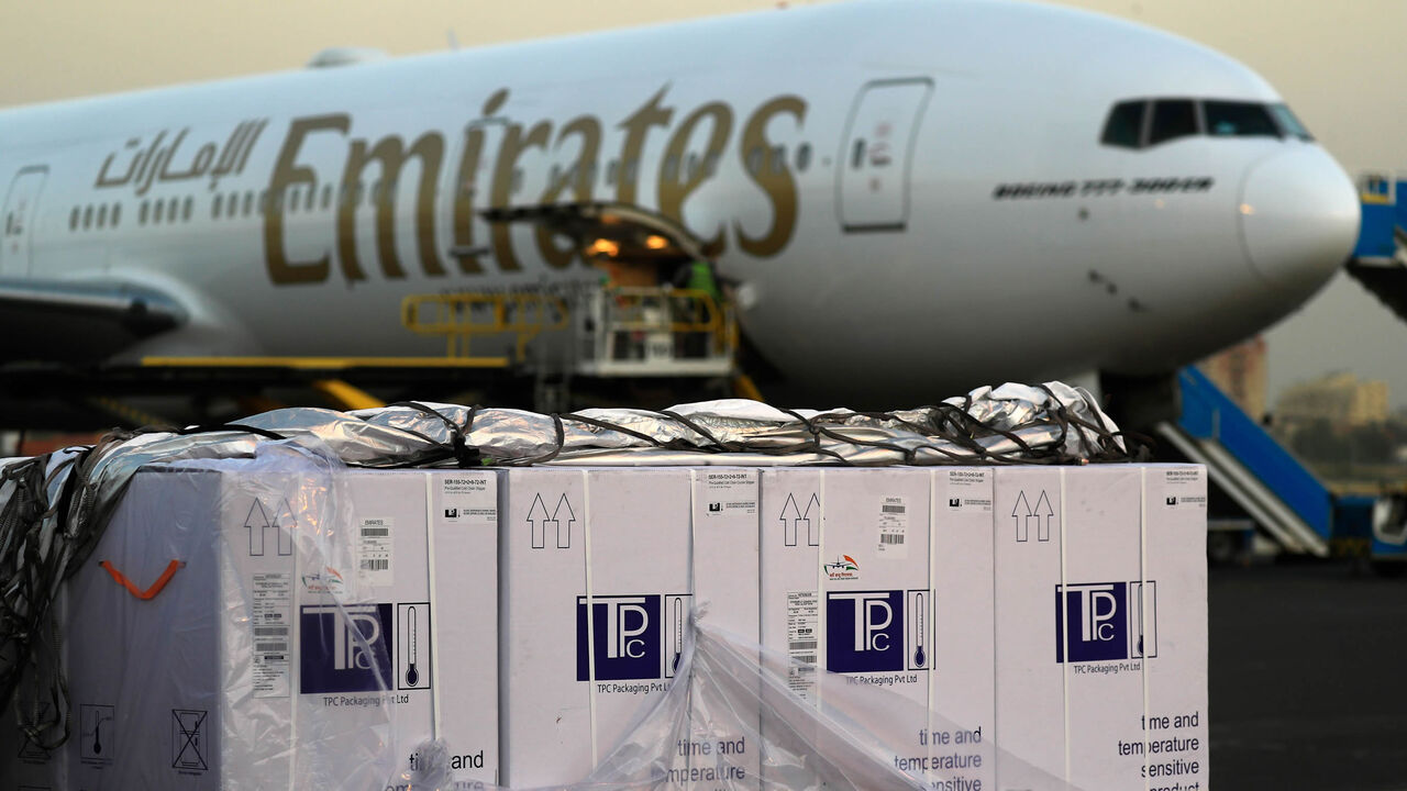Boxes of coronavirus vaccines are stacked on the tarmac after the first batch arrived at Khartoum airport on an Emirates Airlines flight, Khartoum, Sudan, March 3, 2121.