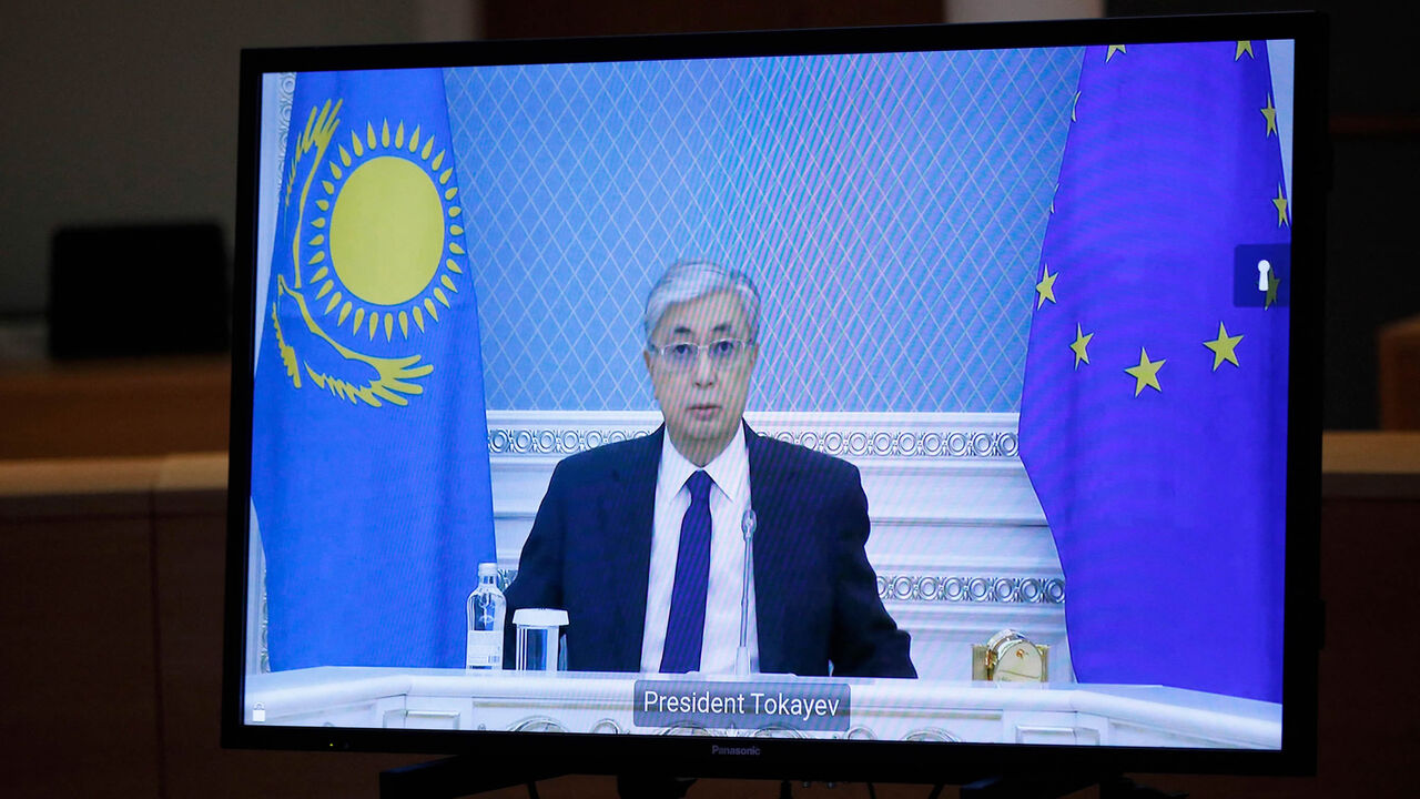 Kazakhstan President Kassym-Jomart Tokayev is seen on a monitor during a video conference with European Council President Charles Michel at the European Council building, Brussels, Belgium, Jan. 10, 2022.