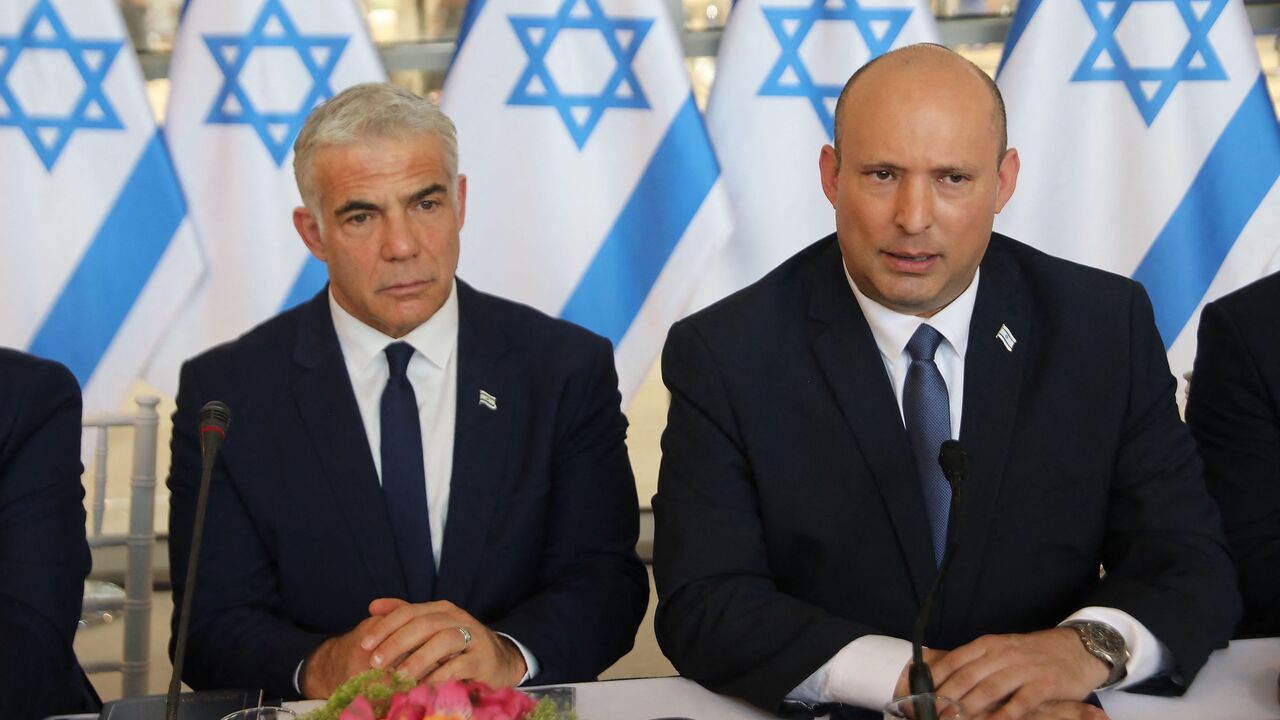 Israeli Prime Minister Naftali Bennett (R) and Foreign Minister Yair Lapid.