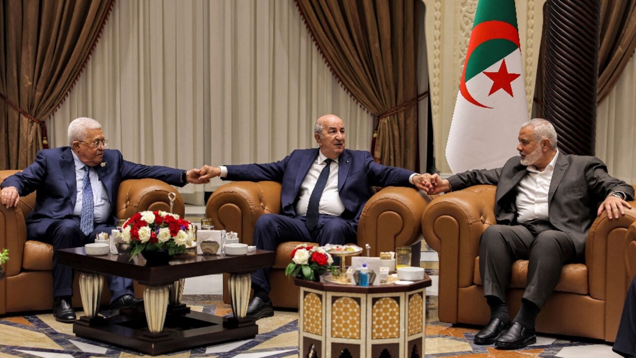 From left to right, Palestinian president Mahmud Abbas, Algerian President Abdelmajid Tebboune and the Hamas movement's leader Ismail Haniyeh