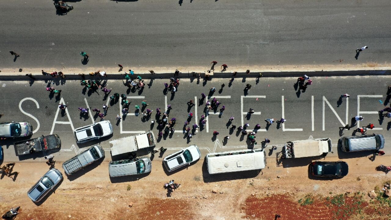 A human chain calling the continued passage of aid into Syria's rebel-held northwestern province of Idlib, seen here in this photograph from July 2, 2021