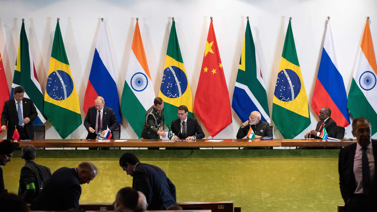 China's President Xi Jinping (L), Russia's President Vladimir Putin (2nd L), Brazil's President Jair Bolsonaro (C), India's Prime Minister Narendra Modi (2nd R) and South Africa's President Cyril Ramaphosa (R) attend a meeting with members of the Business Council and management of the New Development Bank during the BRICS Summit in Brasilia, Brazil, Nov. 14, 2019.