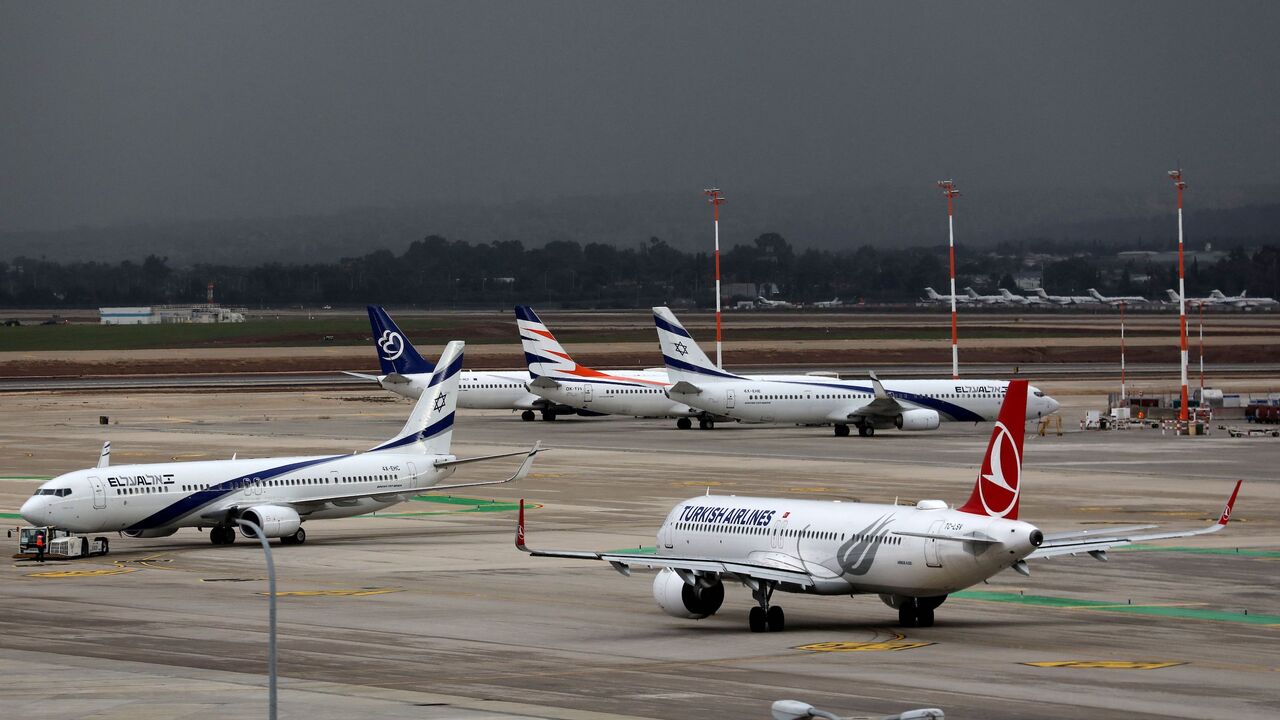 (Foreground L to R) a Boeing 737 aircraft of Israel's El Al and an Airbus A321 aircraft of Turkish Airlines.