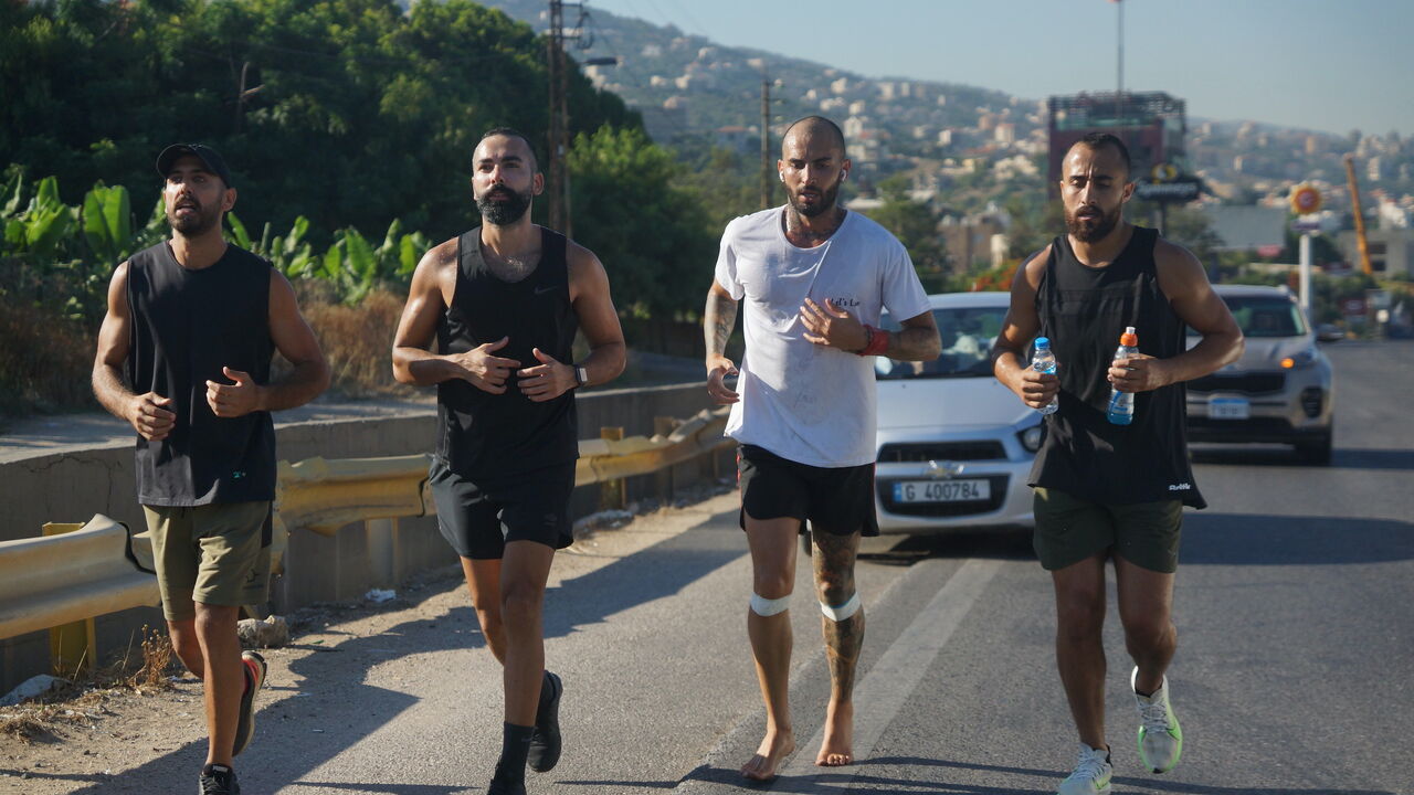 Raymi Naouss, third from left, runs barefoot.