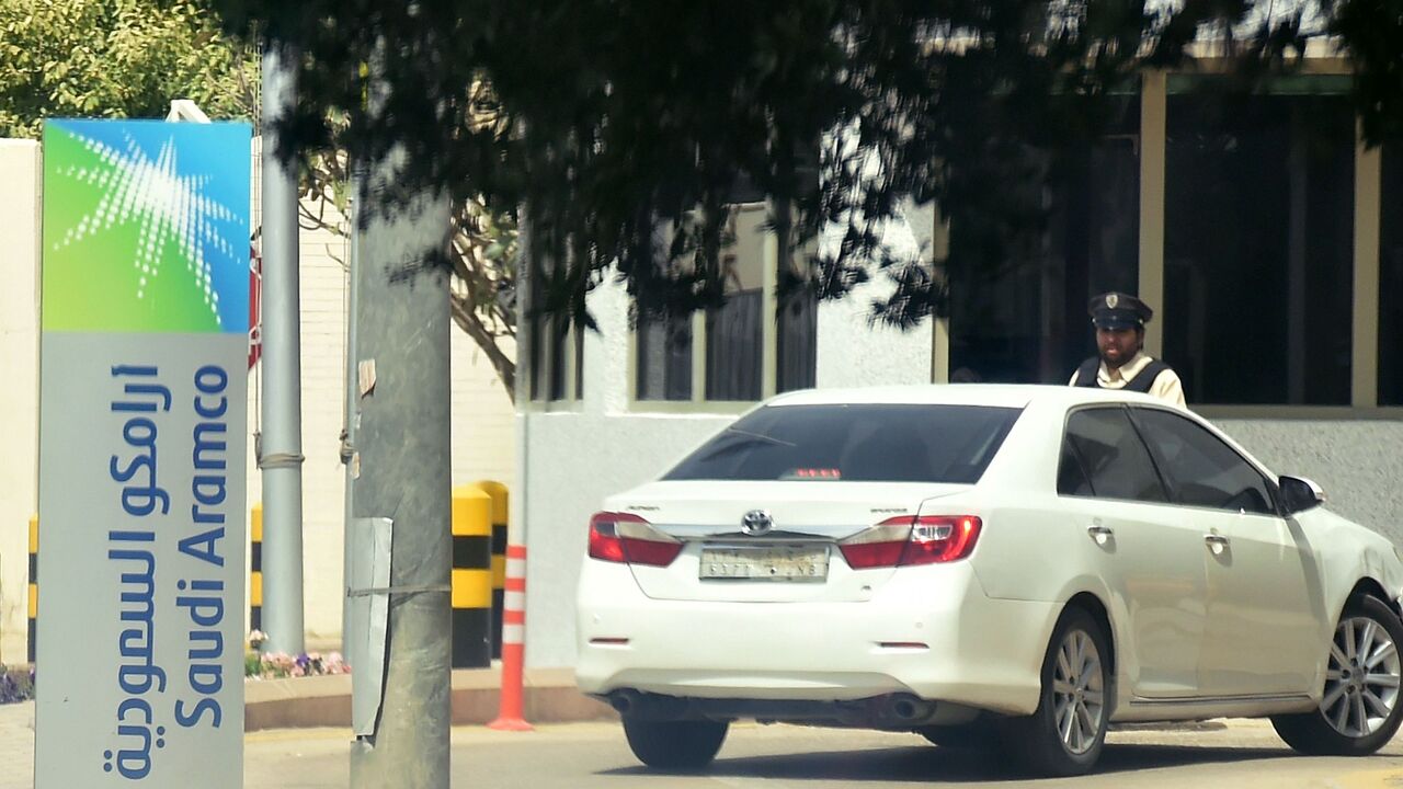 A picture taken on March 12, 2020, shows the logo of energy giant Saudi Aramco at the entrance of its main building in Riyadh.