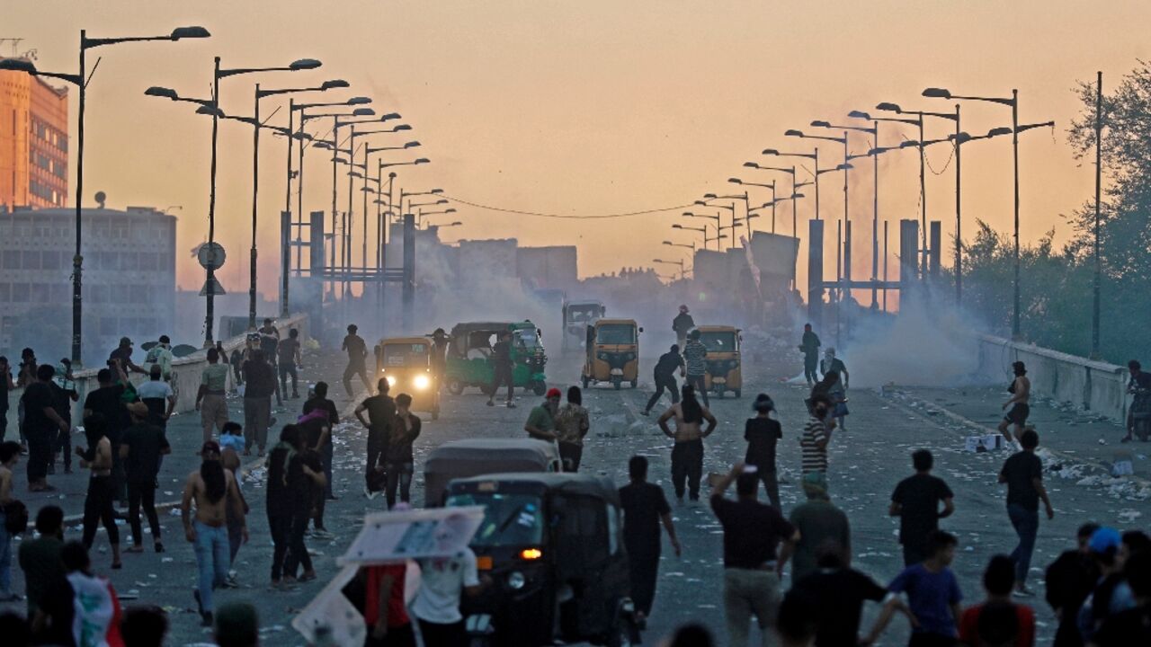 Supporters of Shiite Muslim cleric Moqtada Sadr clash with Iraqi security forces in the Iraqi capital