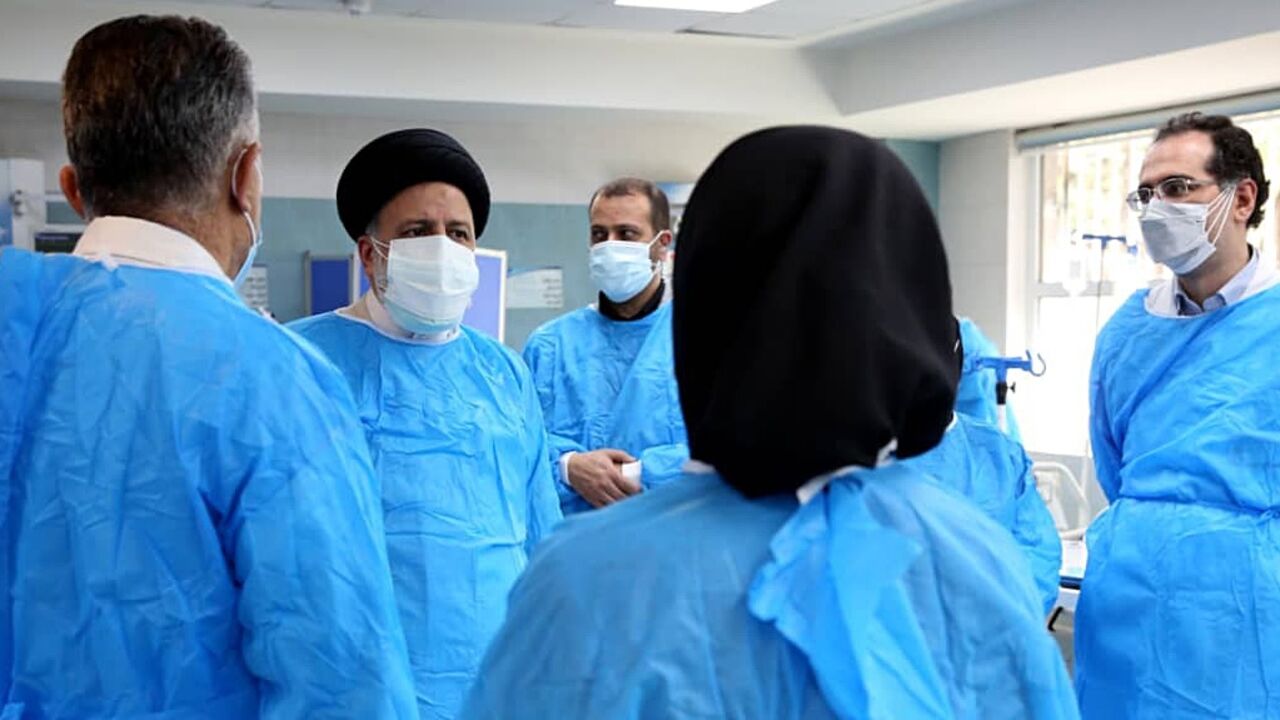 Iranian President Ebrahim Raisi visits a hospital in Tehran in August 2021